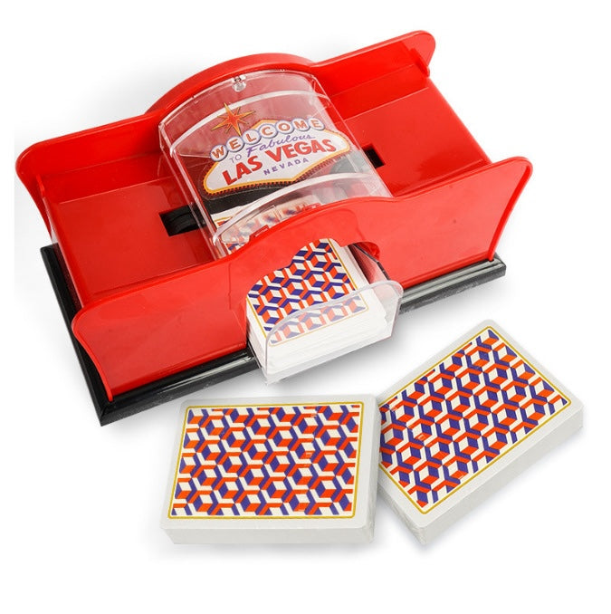 Automatic card shuffler for card games with playing cards on a table.